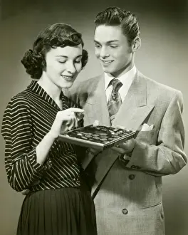 Candy Prints: Man offering woman box of chocolates