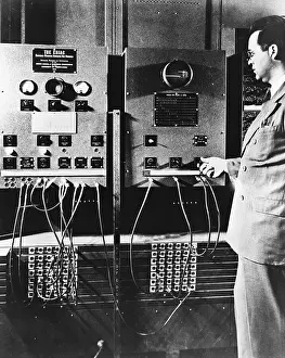 Computer Prints: Man Operates Part of ENIAC
