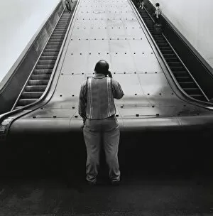 Man at bottom of Path train escalators in New York City