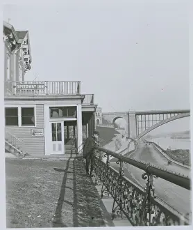 Lodgings Prints: Man Peering Over Balcony of Speedway Inn
