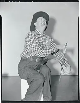 Man Performing with a Saw