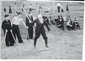 Man Playing a Game of Gorodki