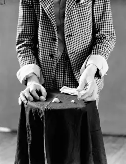 Grownup Prints: Man playing shell game