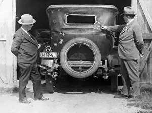 Minnesota Prints: Man Pointing To Holes In Car