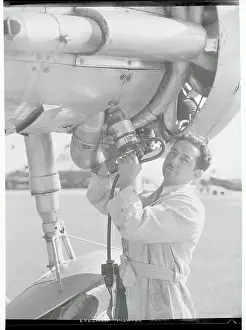 Burbank Prints: Man with Portable Airplane Starter