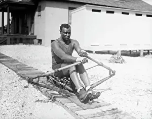 Man Practicing Rowing On A Machine