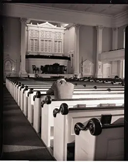 Man Praying in Empty Church