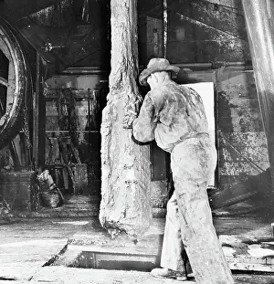 Petroleum Prints: Man Preparing Drill For Boring; Grease