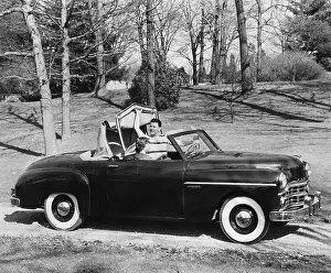 Man Puts Back Convertible Car Top