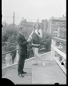 Man Putting Ring on Woman's Finger