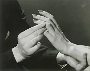 Images Dated 28th February 2008: Man putting wedding ring on womans finger
