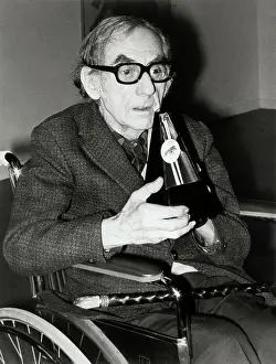 Visual Artists Prints: Man Ray Holding His Work Entitled Indestructible Object