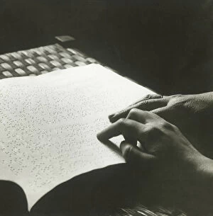 Man reading braille, close up of hands