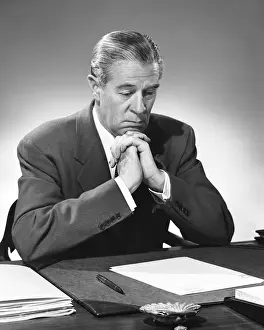 Report Prints: Man reading document