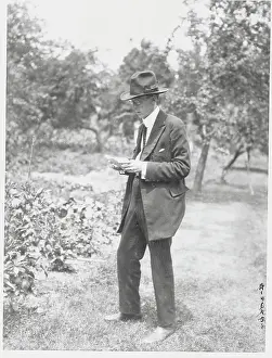 Man Reading in Garden