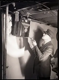 Basement Prints: Man Reading Gas Meter in Basement