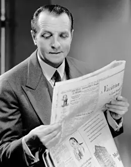 Man reading newspaper