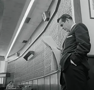 Information Prints: Man Reading Stock Figures