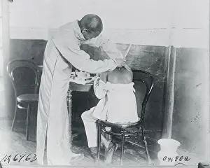 Man Receiving Aid from Chinese Druggist