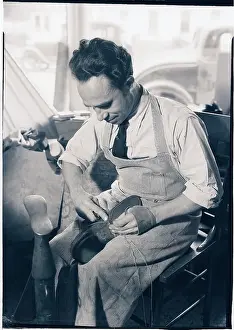 Sewing Prints: Man Repairing Shoe