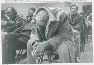 Man Resting with His Jacket Pulled Over His Head