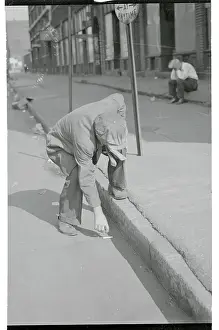 Gutter Prints: Man Retrieving a Cigarette