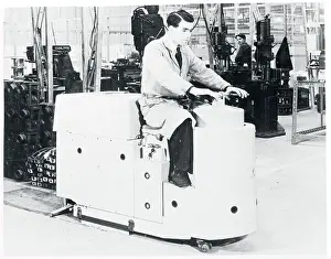 Man Riding Battery Powered Scrubbing Machine