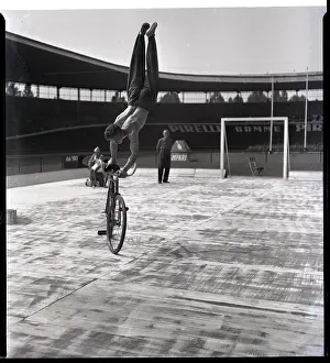 Bicycling Prints: Man Riding Bicyce Doing Handstand
