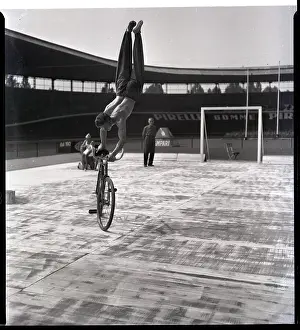 Bicycling Prints: Man Riding Bicyce Doing Handstand