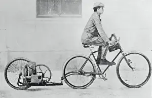 Man Riding Bicycle Being Propelled by Engine
