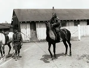 Man Riding Horse with Masks on Each