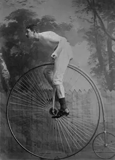 Bicycling Prints: Man Riding Penny-Farthing Bicycle