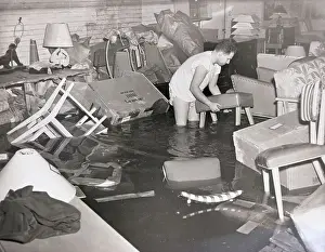 Flood Prints: Man Salvaging During Flood in Basements