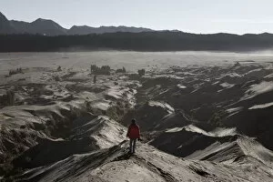 Looking At View Gallery: One man and sand dune at mount Bromo