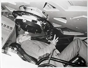 Man Seated Under Isaac Newton Telescope