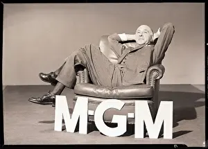 Hands Behind Head Prints: Man Seated in Leather Chair