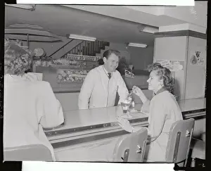 Socializing Prints: Man Serving Sundae to Girl in Soda Shop