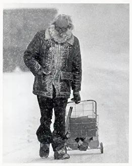 Blizzard Prints: Man with Shopping Cart Walking in Snowstorm