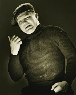 Man showing direction with thumb, posing, (B&W), (Portrait)