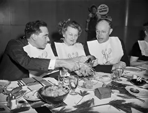 Teaching Prints: Man Showing Others How To Eat Lobster