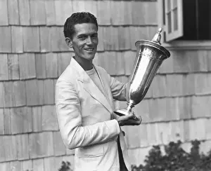 Man Shown with Golfing Trophy