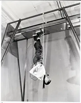 Difficult Prints: Man Shown Walking Upside-Down