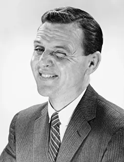 Making A Face Prints: Man shrugging, posing in studio, (B&W), portrait