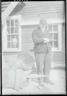 Man Shucking an Oyster