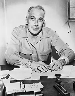 Man Sitting at His Desk