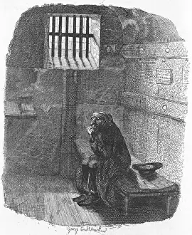 Man Sitting in Prison Cell