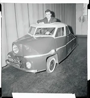 Man Sitting in Three Wheeled Car