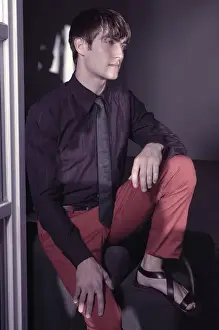 Contemplative Prints: Man sitting at the window, fashion shoot