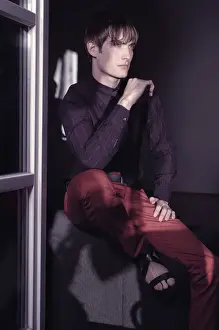 Contemplative Prints: Man sitting at the window, fashion shoot