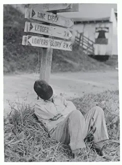 Tiredness Prints: Man Sleeping Under Crossroads Signpost